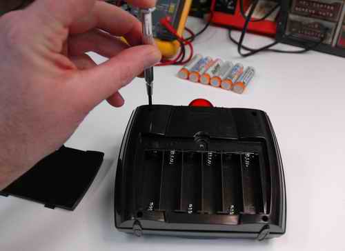 Unscrewing The 4 Phillips Screws On The Back Of The IR Controller